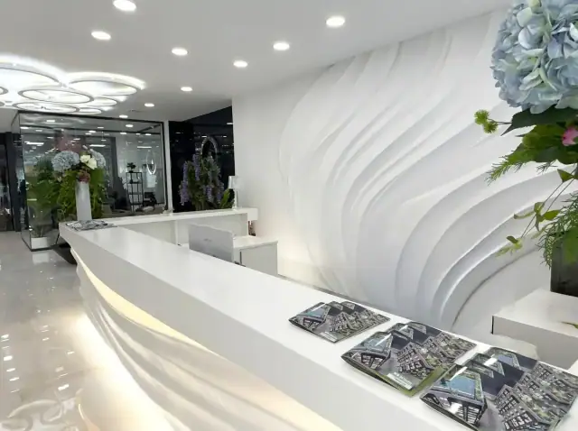 Reception desk at the Valencia office, with development brochures